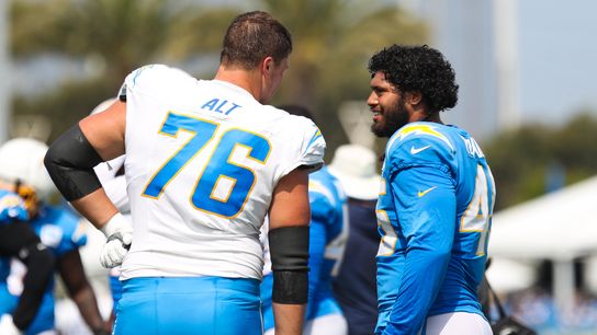 Joe Alt #76 and Tuli Tuipulou #45 of the Los Angeles Chargers speak to each other during training camp at The Bolt on August 11, 2026 in El Segundo, California. Joe Alt #76 and Tuli Tuipulou #45 of the Los Angeles Chargers speak to each other during training camp at The Bolt on August 11, 2026 in El Segundo, California.