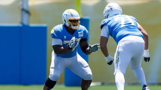 Zion Johnson #77 of the Los Angeles Chargers blocks during training camp at The Bolt on July 24, 2025 in El Segundo, California.
