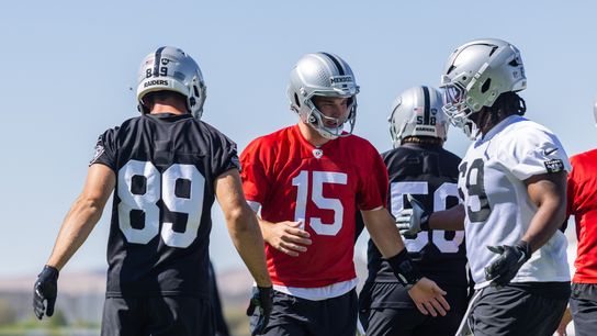 Las Vegas Raiders quarterback Fernando Mendoza (15) high-fives teammates during Raiders OTAs at Intermountain Health Performance Center, Wednesday May 20, 2026 in Henderson, Nev.
