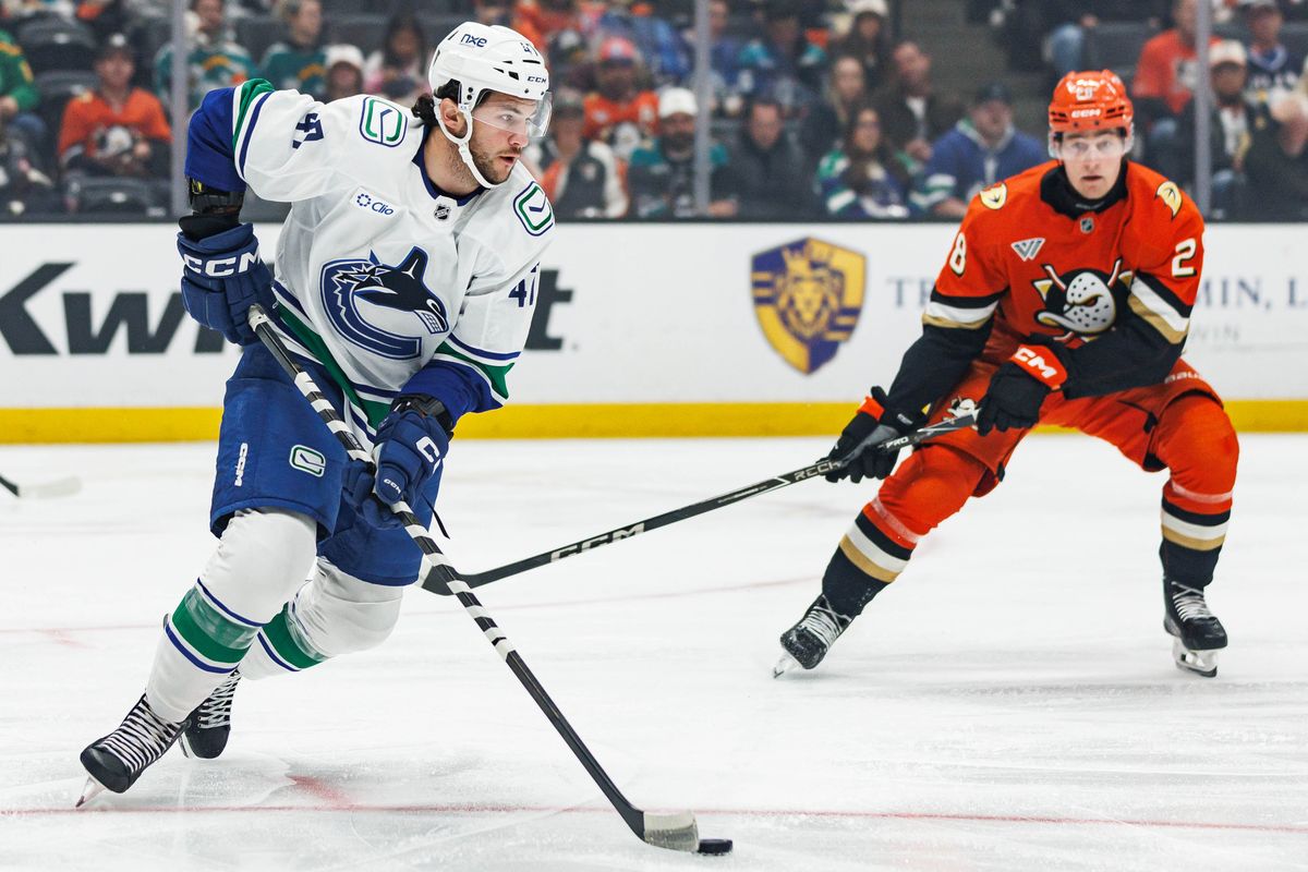 Paul Cotter #47 of the Vancouver Canucks looks to pass the puck during an NHL regular season game against the Anaheim Ducks on October 27, 2026 at Honda Center in Anaheim, California. Paul Cotter #47 of the Vancouver Canucks looks to pass the puck during an NHL regular season game against the Anaheim Ducks on October 27, 2026 at Honda Center in Anaheim, California.