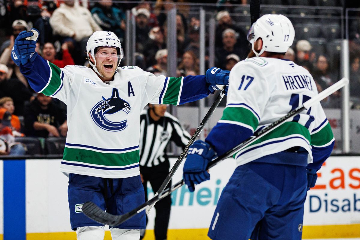 Brock Boeser #6 of the Vancouver Canucks celebrates after giving a game-winning assist to Filip Hronek #17 of the Vancouver Canucks during an NHL regular season game against the Anaheim Ducks on October 27, 2026 at Honda Center in Anaheim, California. Brock Boeser #6 of the Vancouver Canucks celebrates after giving a game-winning assist to Filip Hronek #17 of the Vancouver Canucks during an NHL regular season game against the Anaheim Ducks on October 27, 2026 at Honda Center in Anaheim, California.