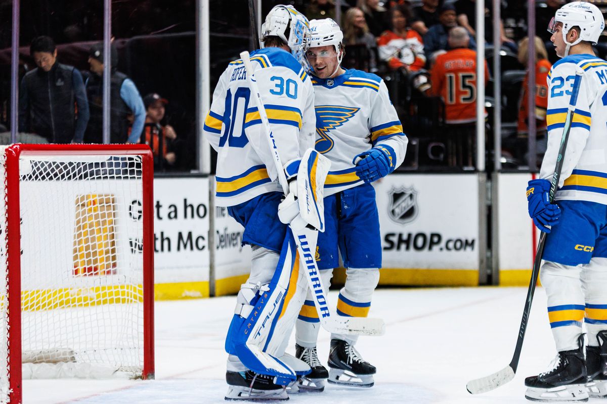 St. Louis Blues goaltender Joel Hofer (#30) celebrates with teammates after a win during an NHL match against the Anaheim Ducks on April 3, 2026 in Anaheim, California.