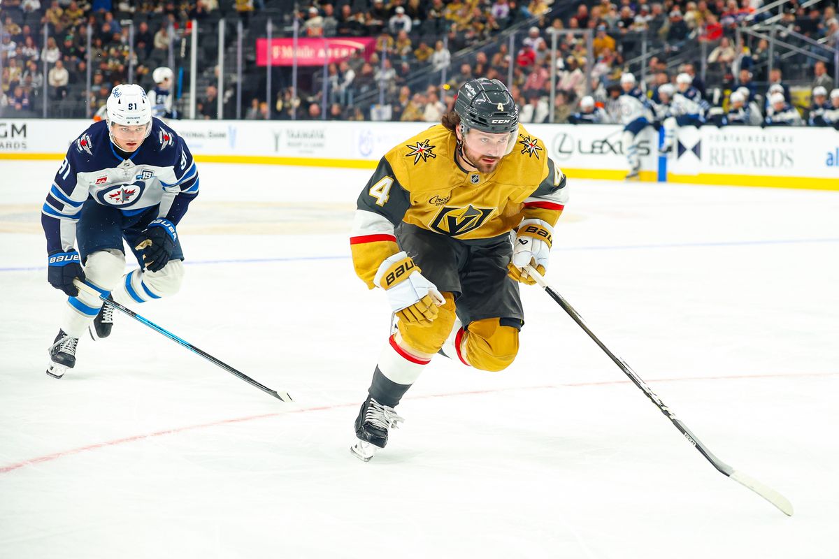 Vegas Golden Knights D Rasmus Andersson (4) outskates past Winnipeg Jets F Cole Perfetti (91) to draw an icing during an NHL game on Monday, April 13, 2026, in Las Vegas, Nevada.  