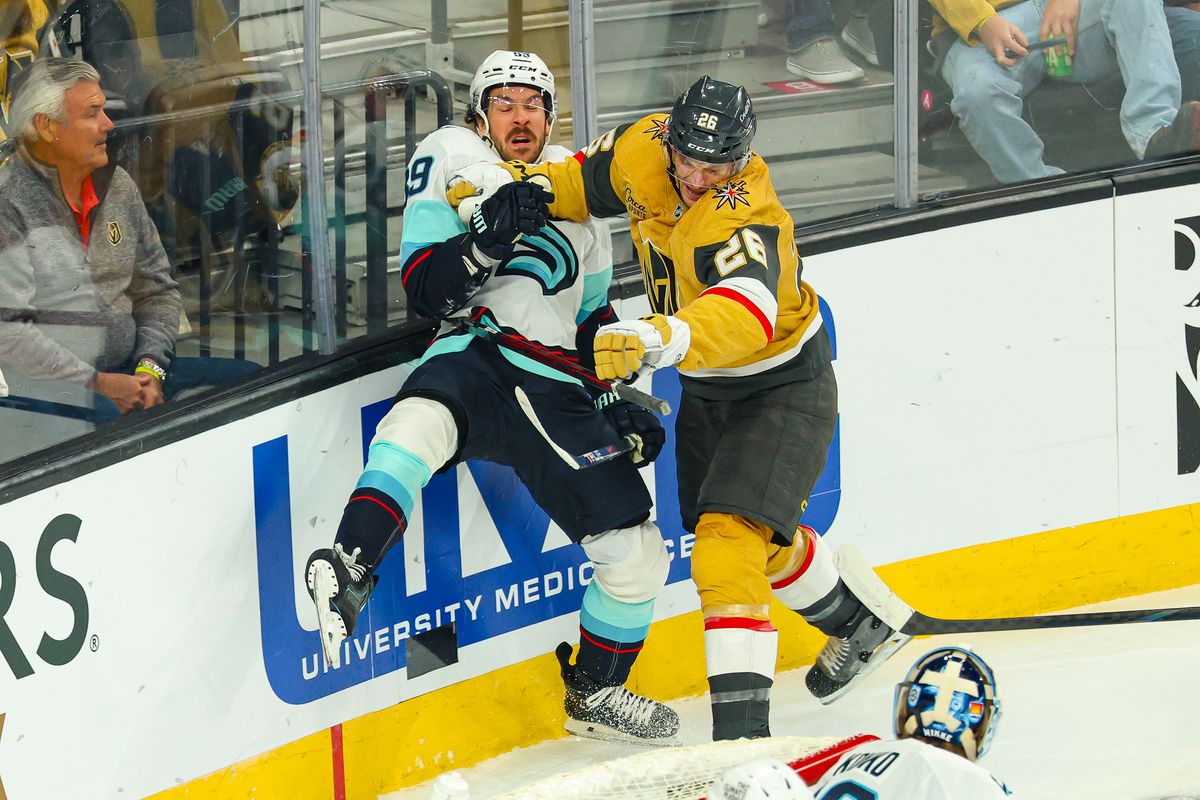 Vegas Golden Knights F Nic Dowd (26) lays a hit on Seattle Kraken F Freddy Gaudreau (89) on Wednesday, April 15, 2026, in Las Vegas, Nevada. 