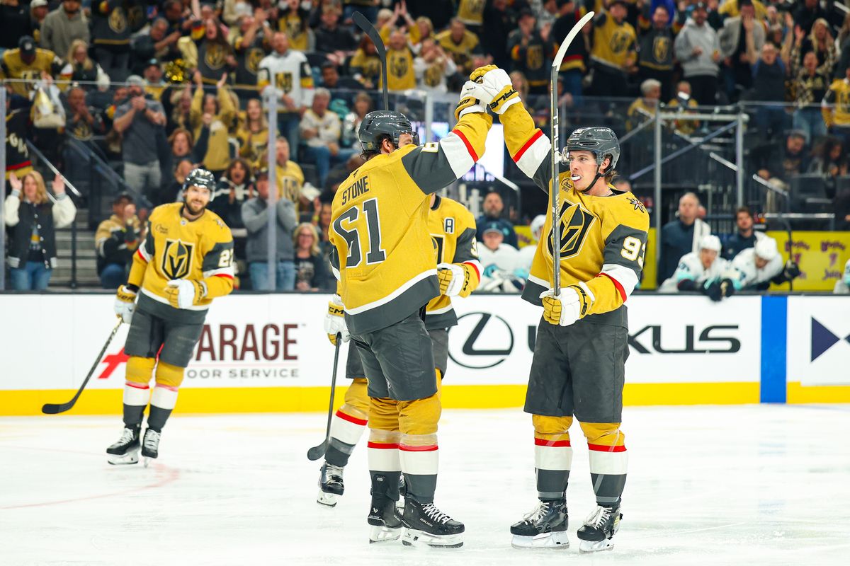 Vegas Golden Knights F Mitch Marner (93) high-fives his teammate F Mark Stone (61) after he scored a deflection goal against the Seattle Kraken on Wednesday, April 15, 2026, in Las Vegas, Nevada. 