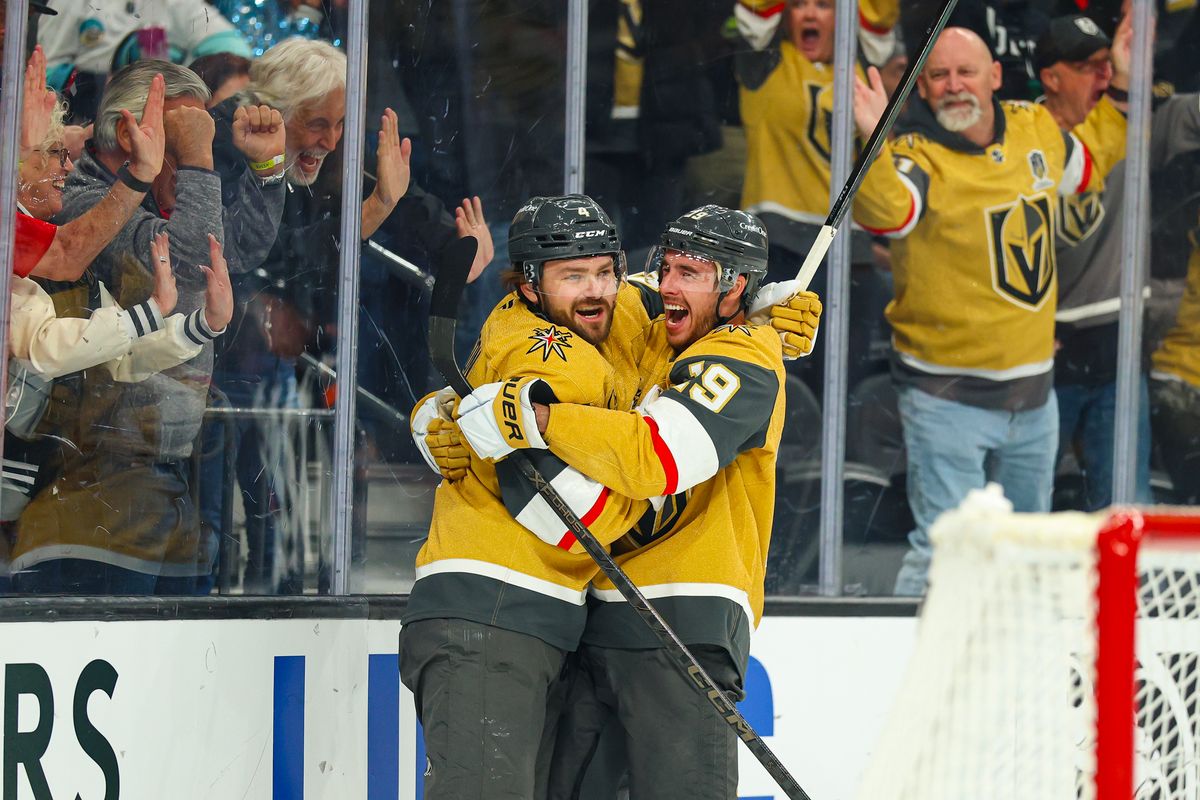 Vegas Golden Knights F Reilly Smith (19) celebrates with his teammate D Rasmus Andersson (4) after scoring a goal in the third period of an NHL game against the Seattle Kraken on Wednesday, April 15, 2026, in Las Vegas, Nevada. 