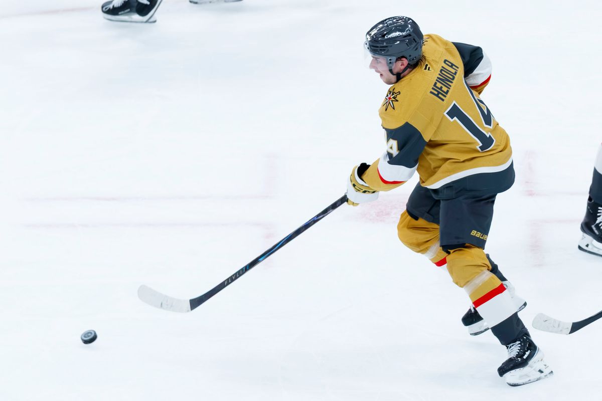 Vegas Golden Knights defenseman Ville Heinola (14) gains possession of the puck in the defensive zone during an NHL game against the Ottawa Senators on Tuesday, October 27, 2026, at T-Mobile Arena in Las Vegas, Nevada.