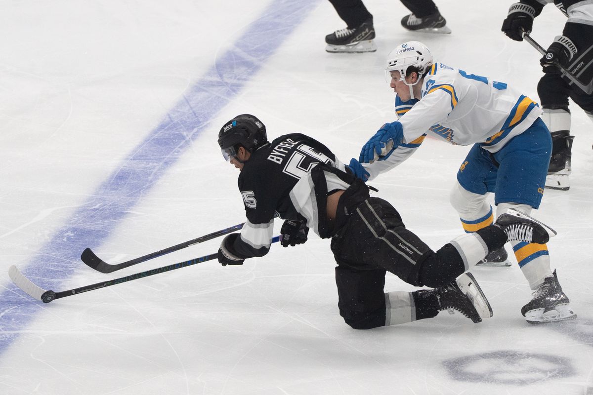 Los Angeles Kings Right Wing Quinton Byfield (55) gets held by his pants while chasing the puck during an NHL match against the St. Louis Blues on April 1st, 2026 in Los Angeles, California.