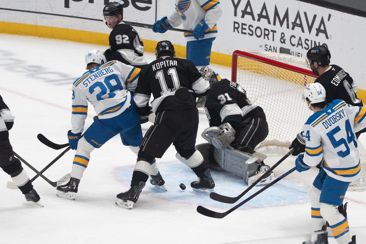 Los Angeles Kings Goalie Anton Forsberg (31) saves the puck from going into the goal while in the crowd during an NHL match against the St. Louis Blues on April 1st, 2026 in Los Angeles, California.