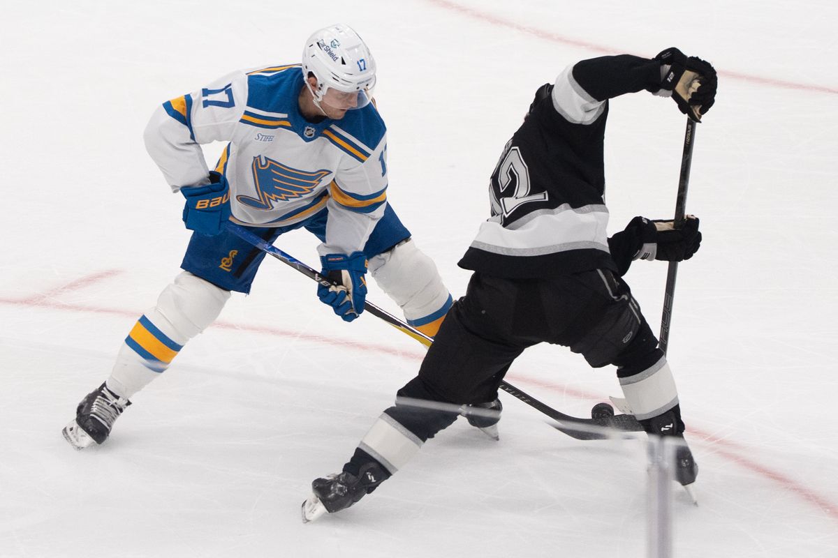 Los Angeles Kings Trevor Moore Byfield (12) fights for the puck during an NHL match against the St. Louis Blues on April 1st, 2026 in Los Angeles, California.