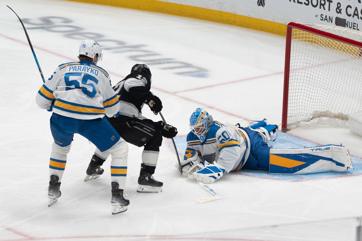 Los Angeles Kings Left Wing Trevor Moore (12) has his shot attempt stopped right in front of him during an NHL match against the St. Louis Blues on April 1st, 2026 in Los Angeles, California.