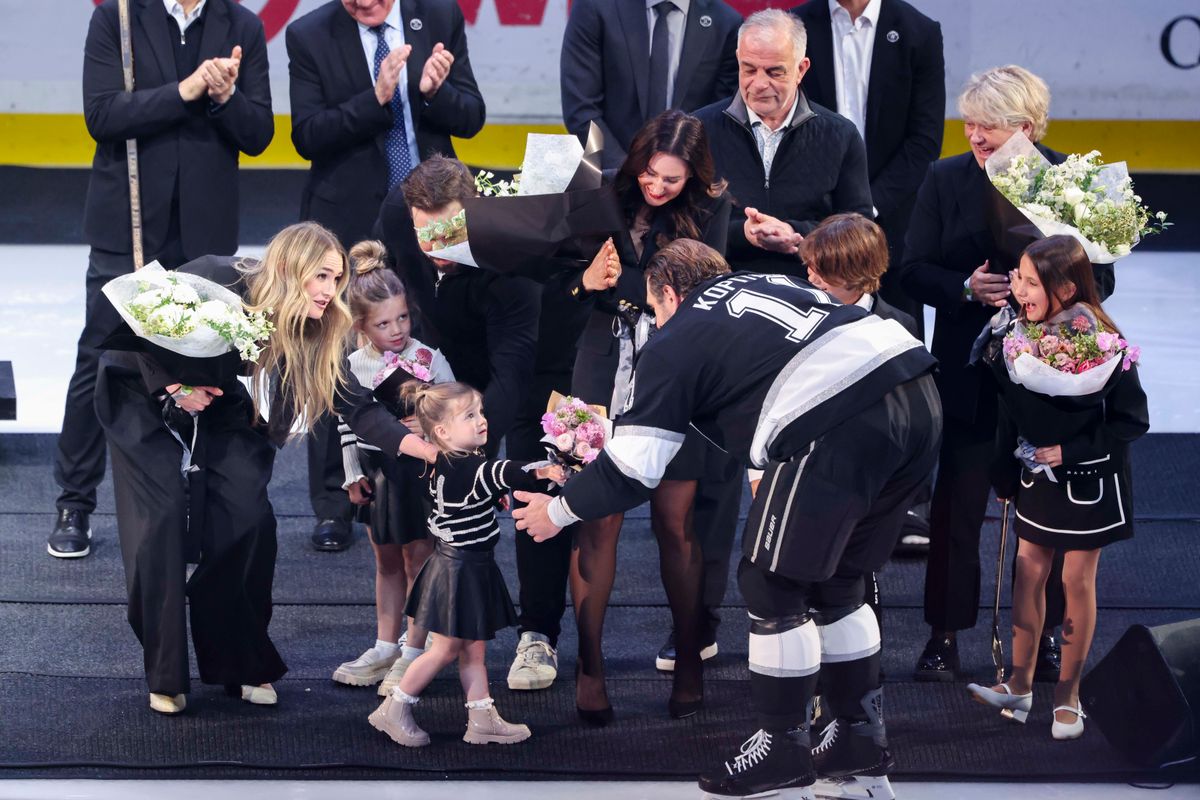 Anze Kopitar #11 of the Los Angeles Kings is greeted by his family before being honored by the team before an NHL hockey game against the Nashville Predators, Thursday April 2, 2026 in Los Angeles, Calif.