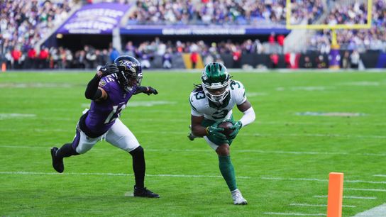 Nov 23, 2025; Baltimore, Maryland, USA; New York Jets wide reciever John Metchie III (3) scores a touchdown as Baltimore Ravens safety Alohi Gilman (12) defends during the second quarter at M&T Bank Stadium.