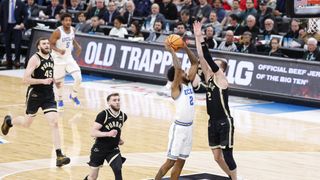  Dent goes down as UCLA loses to Purdue in Big Ten Tournament taken at United Center (UCLA Bruins). Photo by Kamil Krzaczynski-Imagn Images