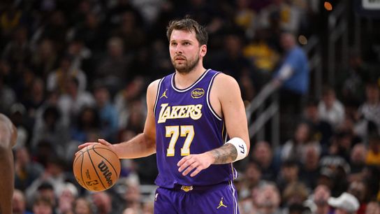 Los Angeles Lakers guard Luka Doncic (77) dribbles the ball down court during the second half against the Indiana Pacers at Gainbridge Fieldhouse. 