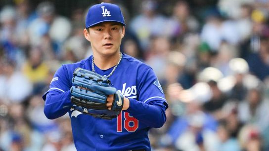 Los Angeles Dodgers starting pitcher Yoshinobu Yamamoto (18) throws a pitch in the sixth inning against the Milwaukee Brewers at American Family Field. 