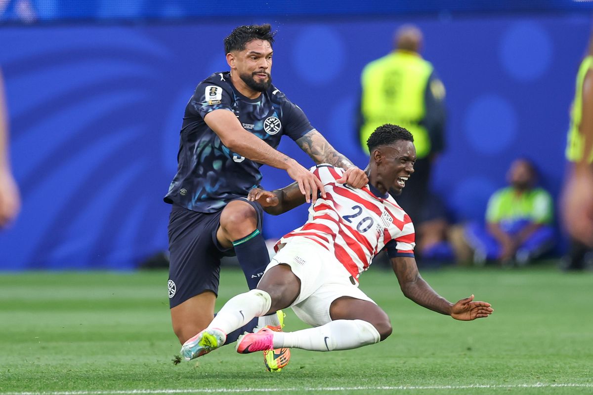 Omar Alderete #3 of Paraguay pushes Folarin Balogun #20 of United States to the ground during a 2026 FIFA World Cup match, Friday June 12, 2026 in Inglewood, Calif. Omar Alderete #3 of Paraguay pushes Folarin Balogun #20 of United States to the ground during a 2026 FIFA World Cup match, Friday June 12, 2026 in Inglewood, Calif.