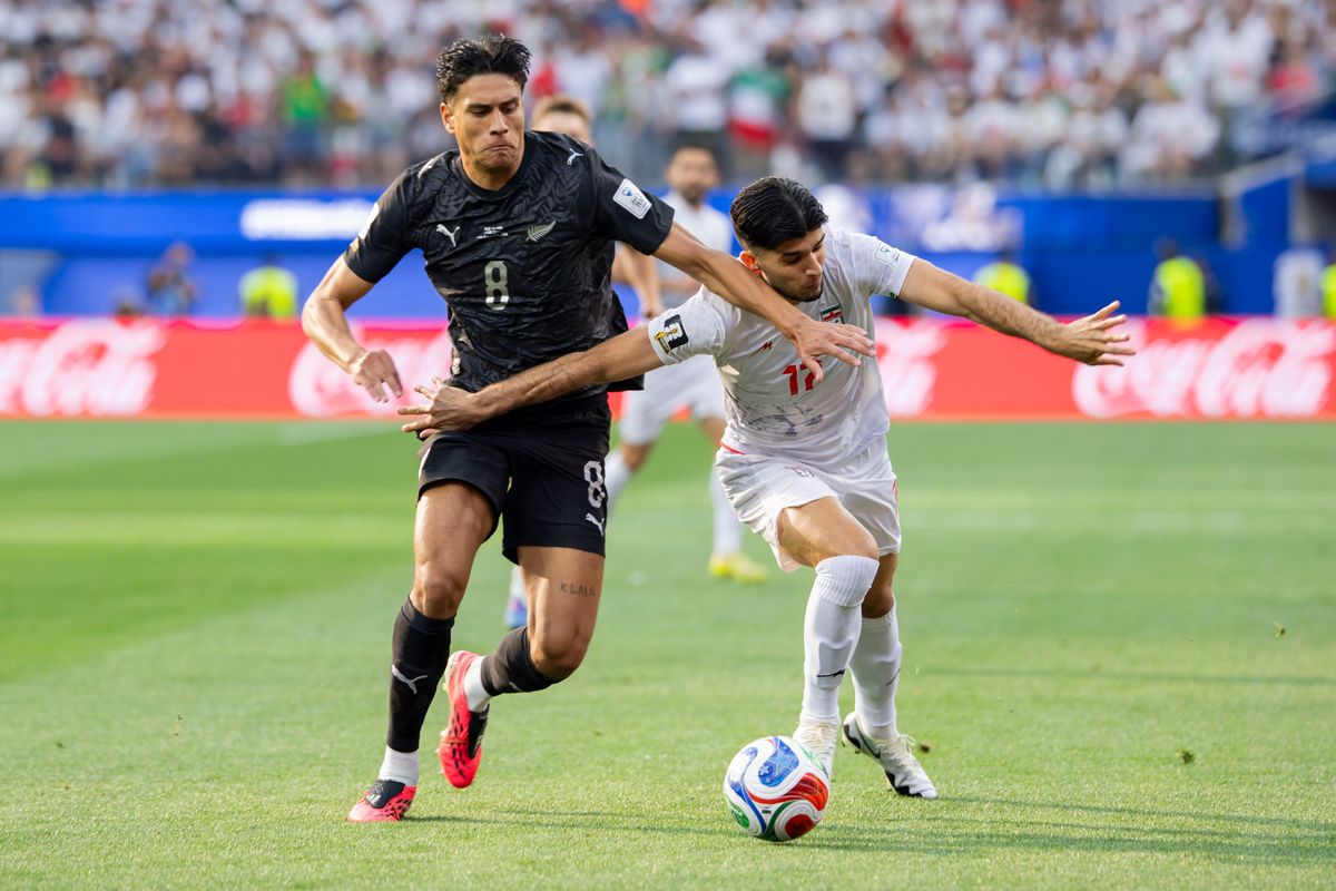 Marko Stamenić #8 of New Zealand and Arya Yousefi #17 of Iran battle for the ball during a 2026 FIFA World Cup match, Monday June 15, 2026 in Inglewood, Calif. Marko Stamenić #8 of New Zealand and Arya Yousefi #17 of Iran battle for the ball during a 2026 FIFA World Cup match, Monday June 15, 2026 in Inglewood, Calif.