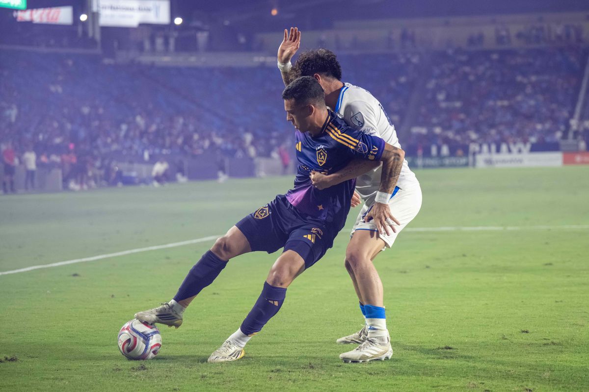 LA Galaxy defender Calegari fights for the ball against Cruz Azul defender Josué Díaz during a friendly soccer game, Sunday, October 4, 2026 in Carson, California.