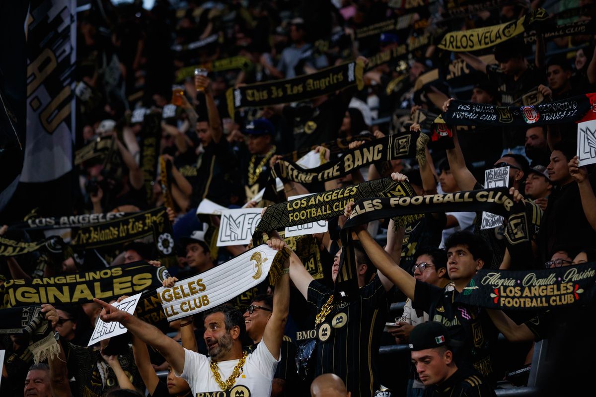 LAFC fans lift up their scarves before an MLS regular season match against LA Galaxy on October 25, 2026 at BMO Stadium in Los Angeles, California.