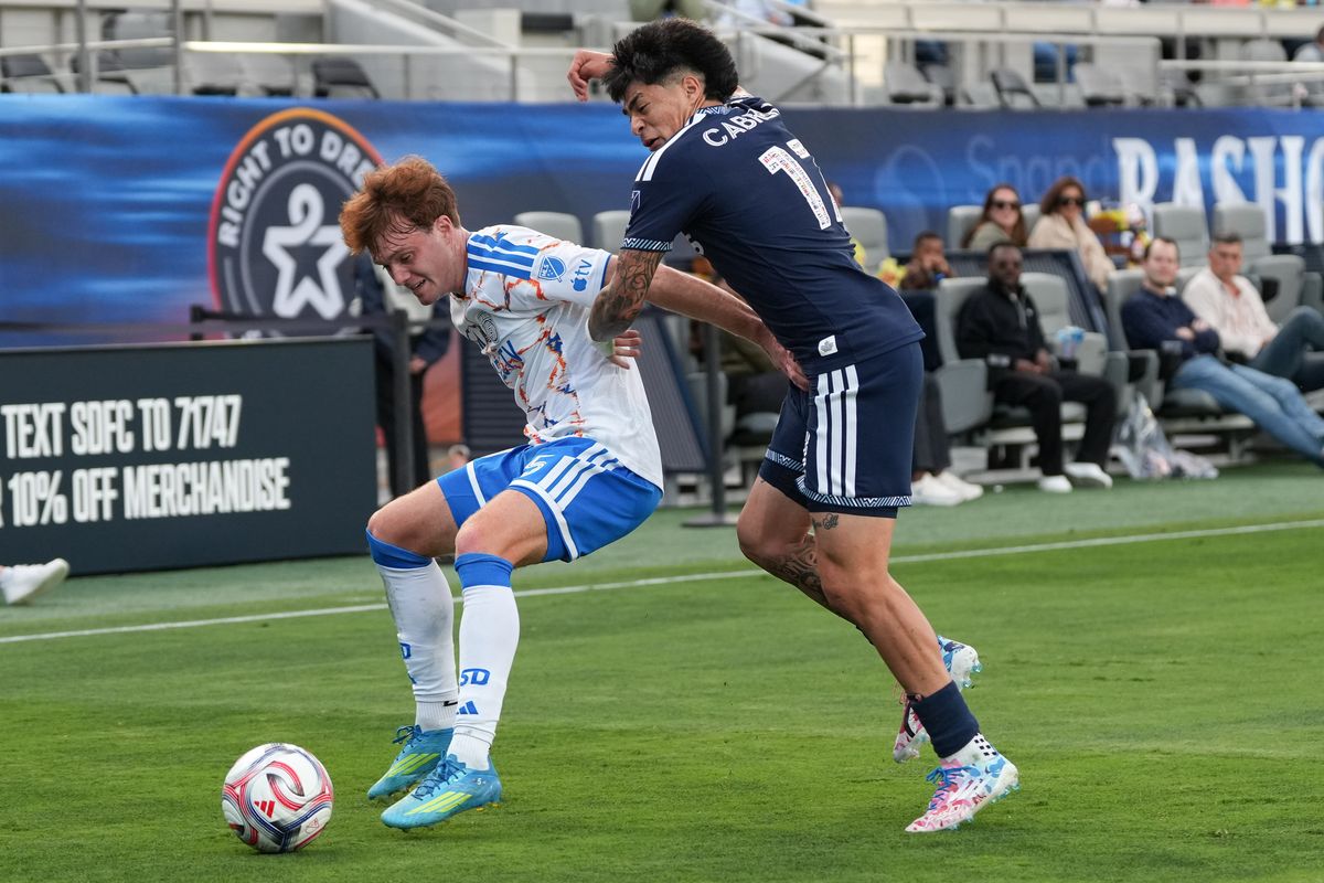 San Diego FC defender Kieran Sargeant (5) shields the ball during an MLS soccer game against the Vancouver Whitecaps, Saturday May 23, 2026 in San Diego, California. San Diego FC defender Kieran Sargeant (5) shields the ball during an MLS soccer game against the Vancouver Whitecaps, Saturday May 23, 2026 in San Diego, California.