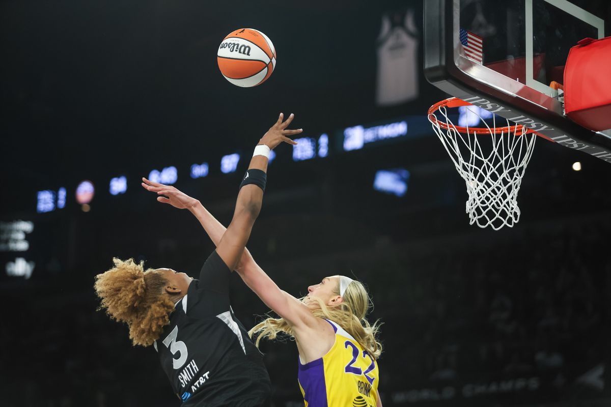 Las Vegas Aces forward NaLyssa Smith (3) goes for a lay-up as Los Angeles Sparks forward Cameron Brink (22) attempts to block the shot during a WNBA game between the Las Vegas Aces and the Los Angeles Sparks, Saturday May 23, 2026 in Las Vegas, Nev. Las Vegas Aces forward NaLyssa Smith (3) goes for a lay-up as Los Angeles Sparks forward Cameron Brink (22) attempts to block the shot during a WNBA game between the Las Vegas Aces and the Los Angeles Sparks, Saturday May 23, 2026 in Las Vegas, Nev.