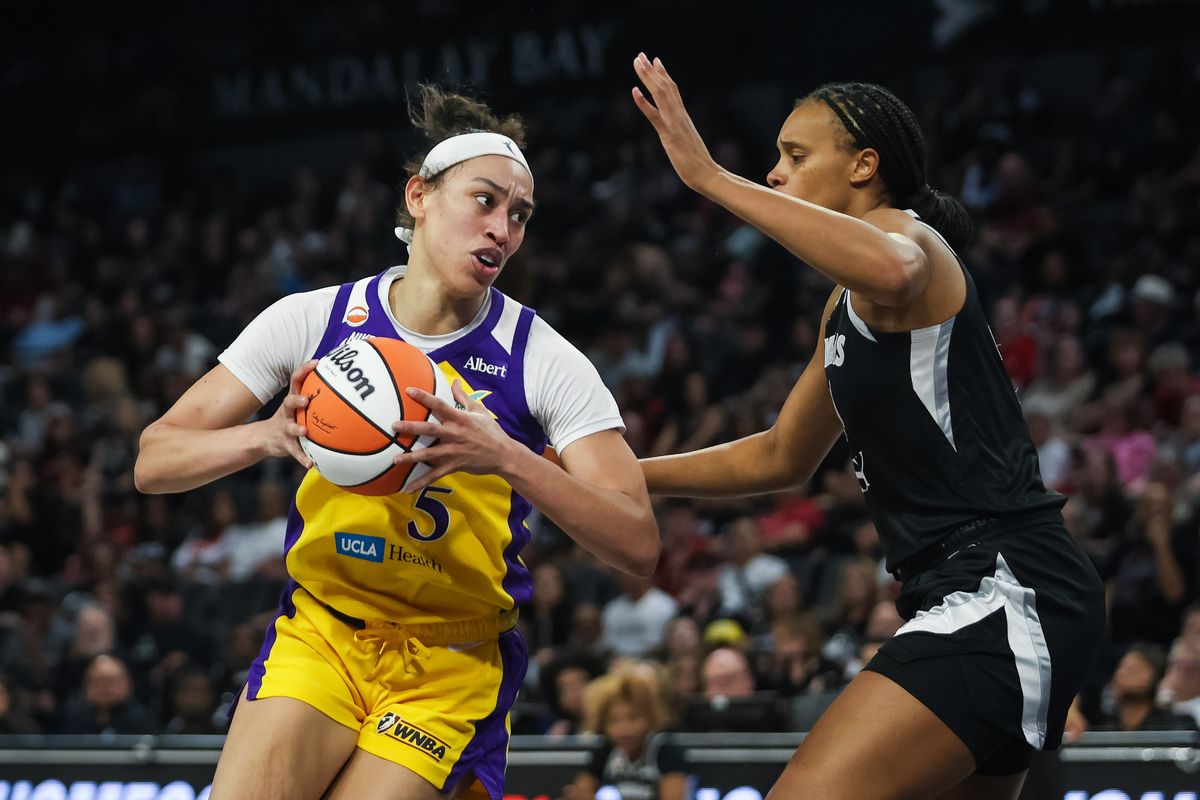 Los Angeles Sparks guard Dearica Hamby (5) does a post move on Las Vegas Aces forward Brianna Turner (21) during a WNBA game between the Las Vegas Aces and the Los Angeles Sparks, Saturday May 23, 2026 in Las Vegas, Nev. Los Angeles Sparks guard Dearica Hamby (5) does a post move on Las Vegas Aces forward Brianna Turner (21) during a WNBA game between the Las Vegas Aces and the Los Angeles Sparks, Saturday May 23, 2026 in Las Vegas, Nev.