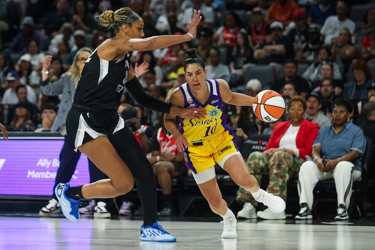 Los Angeles Sparks guard Kelsey Plum (10) dribbles towards the basket as Las Vegas Aces forward A’ja Wilson (22) defends her during a WNBA game between the Las Vegas Aces and the Los Angeles Sparks, Saturday May 23, 2026 in Las Vegas, Nev. Los Angeles Sparks guard Kelsey Plum (10) dribbles towards the basket as Las Vegas Aces forward A’ja Wilson (22) defends her during a WNBA game between the Las Vegas Aces and the Los Angeles Sparks, Saturday May 23, 2026 in Las Vegas, Nev.